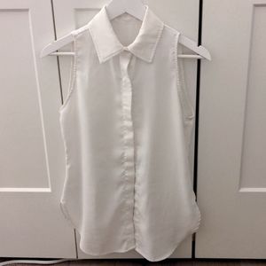 White sleeveless button up collared shirt for layering with sweaters